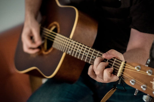 Electric guitar and amplifier in a recording studio setup with DAW software