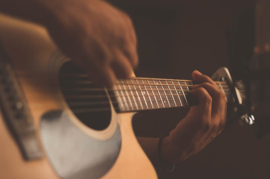 Electric guitar in a moody studio setting with dramatic lighting, perfect for ambient guitar recording