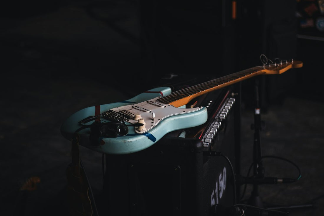 Electric guitar resting on an amp head in a studio setting, representing the modern capture platform ecosystem