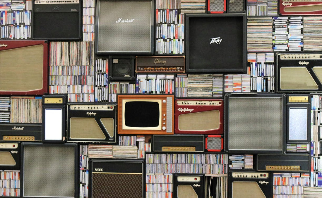 Guitar amplifiers and pedalboard gear in a studio setting, representing the competitive modeler market of 2026
