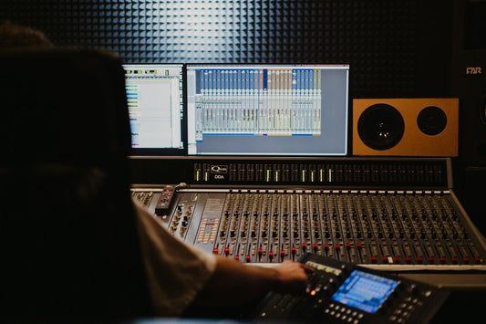 Home recording studio with audio interface and computer used for reamping guitar DI through captures and profiles