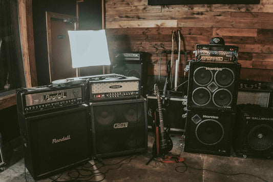 Close-up of a guitar amplifier head with knobs and controls for dialing in high-gain metal tones