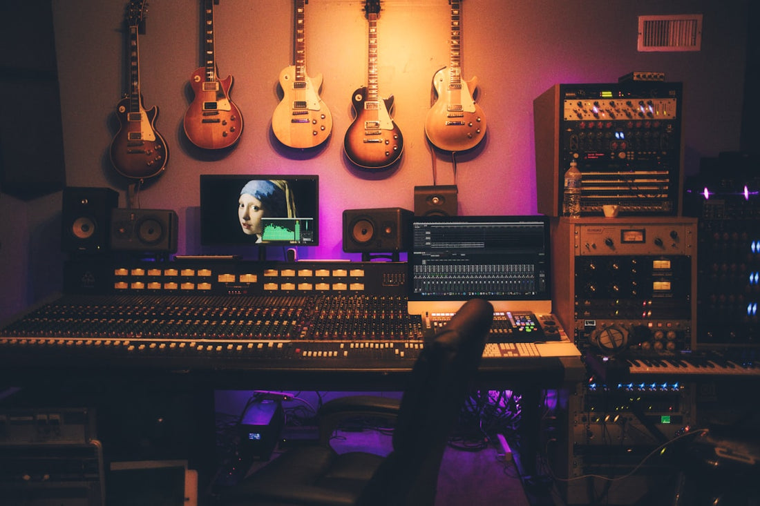 Recording studio with audio equipment and mixing console for guitar DI recording and reamping